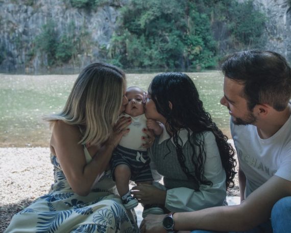 Family enjoying quality time together by the scenic riverside backdrop.